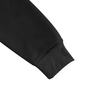 Close-up detail of the ribbed knit cuff on a premium black long-sleeve sweatshirt