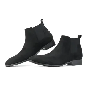 Detailed side view of men's black suede Chelsea boots with a modern square toe design