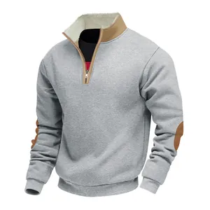 Detailed view of grey men's half-zip sweatshirt with fleece collar and elbow patches