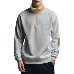 Detail view of men's grey half-zip sweatshirt with fleece collar and elbow patches