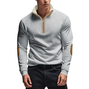 Close-up of men's half-zip grey sweatshirt featuring fleece collar and elbow patches