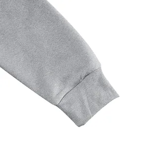 Macro view showing the high-quality ribbed cuff detail of a gray men's vintage hoodie