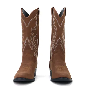 Front view of brown leather cowboy boots with white decorative western embroidery