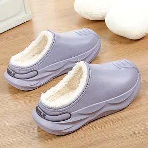 Close-up detail of lilac fleece-lined waterproof EVA clogs for winter outdoor use.