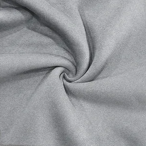 Detailed close-up of premium grey cotton sweatshirt fabric showing soft twill texture