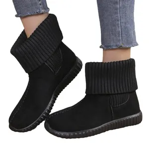 Stylish women's black snow boots featuring knitted cuffs and flat anti-slip soles for winter