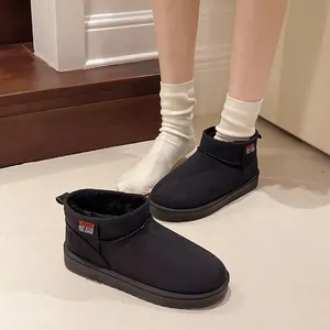 Detailed view of warm black fleece-lined ankle boots featuring non-slip soles and plush interior