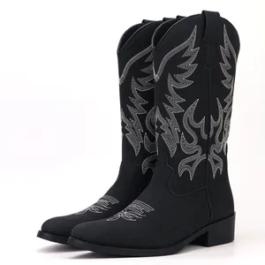 Men's retro black Western cowboy boots featuring intricate white embroidery, mid-calf height