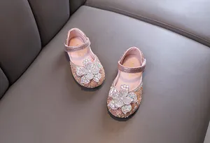 Exquisite pink glittery princess shoes for girls featuring a large sparkling crystal flower