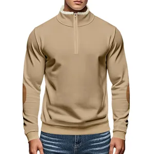 Detailed view of men's khaki half-zip sweatshirt featuring a sherpa collar and retro elbow patches.