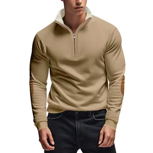 Detailed view of men's half-zip sweatshirt with fleece collar and vintage elbow patches