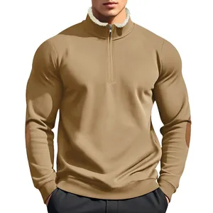 Men's khaki half-zip sweatshirt detail featuring a sherpa collar and brown elbow patches.