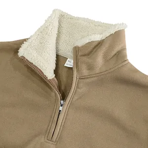 Close-up detail of men's khaki quarter-zip sweatshirt with white sherpa fleece collar