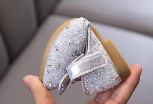 Detailed macro shot showing the flexible sole of silver rhinestone girl's princess shoes