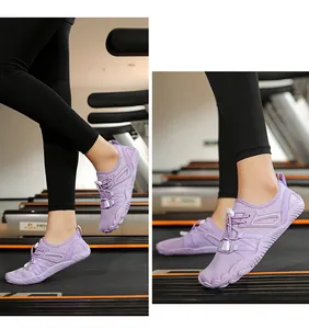 Close-up action shot of purple lightweight minimalist barefoot fitness shoes on a gym treadmill