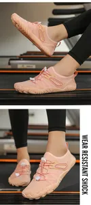Detailed close-up of pink breathable mesh barefoot shoes for gym and indoor yoga
