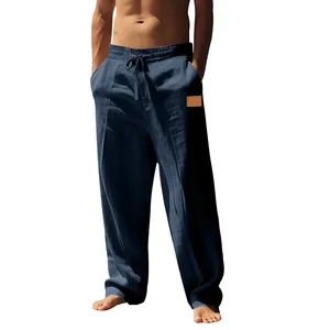 Full view of men's navy blue linen pants showing loose fit and drawstring waist