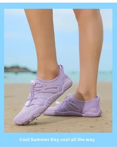 Light purple breathable outdoor water shoes worn on beach for swimming and fitness