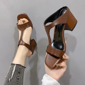 Stylish brown women's square-toe mules featuring a comfortable block heel and T-strap design.