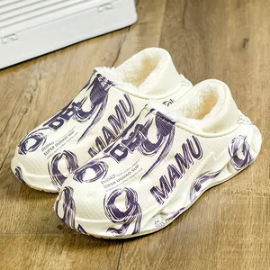 Detail view of white platform slippers with warm fur lining and purple graphics
