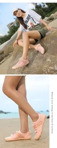 Detail view of breathable pink outdoor water shoes worn by a model on a sunny beach.