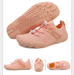 Detail view of breathable peach wading shoes with non-slip textured rubber sole