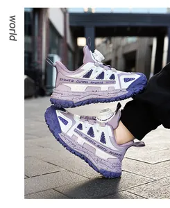 Detail view of durable purple children's outdoor sports shoes with rotary buckle laces.
