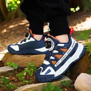Durable kids outdoor sports sneakers with quick dial lacing system in navy and orange