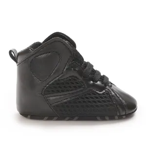 Side detail of black high-top baby walking shoes with breathable mesh and soft soles.