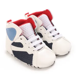 Detailed view of infant mid-top casual walking shoes with soft sole in white and red