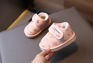 Detailed view of pink fleece-lined baby snow boots featuring cute cartoon bear patterns