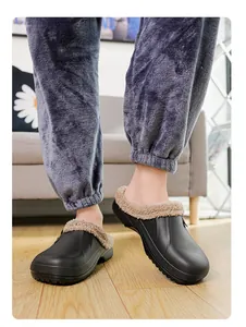 Close-up of black waterproof slippers with warm fleece lining for winter