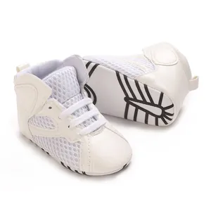 Detailed view of the breathable mesh upper and soft non-slip sole of the baby shoes