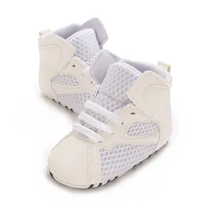 Detailed view of white breathable mesh high-top baby walking shoes with soft soles