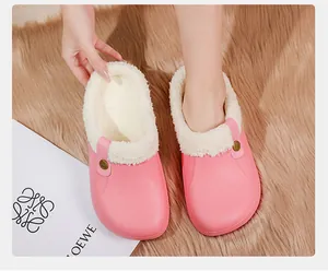 Comfortable pink winter clogs with thick fleece lining shown on a plush rug for indoor warmth