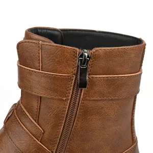 Macro view of the durable side zipper and high-quality leather texture on brown vintage boots