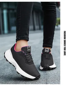Close-up of breathable black sneakers for teenage girls on urban pavement