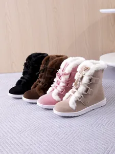 Four colors of women's faux fur lined snow boots with lace-up detail and flat soles