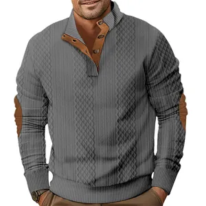Close-up of grey jacquard sweatshirt featuring brown elbow patches and button-down collar.