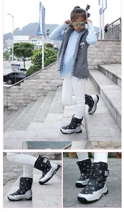 Detailed view of children's snowflake pattern snow boots with rugged non-slip soles