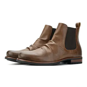 Side view of vintage men's brown ruched Chelsea boots with double elastic side panels