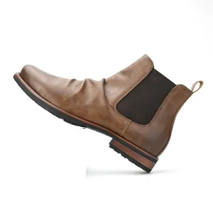 Detail side view of brown men's Chelsea boots with elastic side and wrinkled leather
