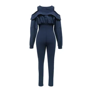 Navy blue cold-shoulder slim fit jumpsuit with ruffled back detail in washed fabric.