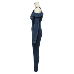 Side view detail of an off-the-shoulder long sleeve bodycon jumpsuit in washed blue.