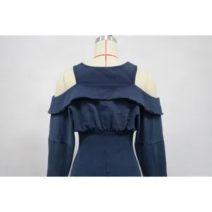 Macro view of a washed navy blue off-shoulder slim-fit bodysuit on a torso mannequin