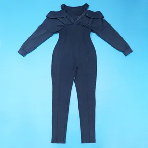 High-quality detail of a washed denim-look slim fit jumpsuit with cold-shoulder