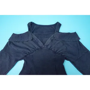 Close-up detail of a vintage washed cold-shoulder bodysuit with ribbed texture design