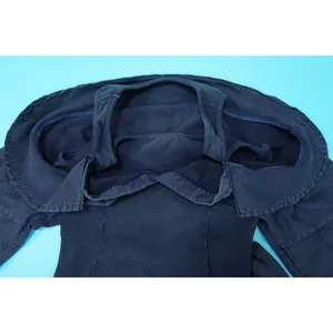 Detailed view of navy blue washed ribbed fabric texture on this sexy off-shoulder jumpsuit garment