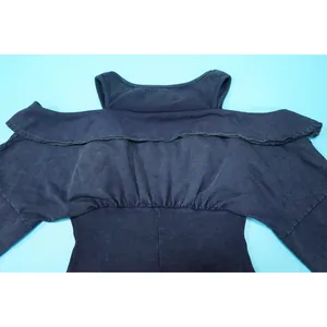 Close-up detail of a navy blue washed cold-shoulder ribbed romper showing fabric texture