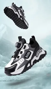 Detail of children's winter sports shoes with rotating buckle and leather upper